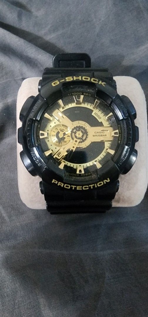 G-Shock GA-100 Watch - Black & Gold (Category: Men's Watches) located in Pasig City. Submitted by anovharz (Listing ID 1458143918, Image 1). Description: - G-Shock GA-100 Watch - Color: Black with Gold Accents - Water Resistance: 20BAR - Features: Durable and Reliable - Ideal for: Everyday Wear or Sports - Rare Color - Other Variants Available: Blue and Orange.