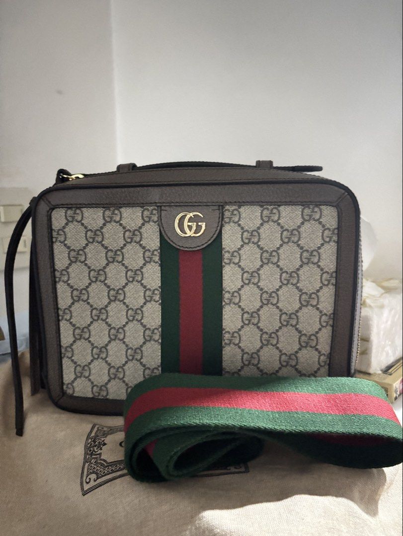 Gucci Ophidia Supreme Vanity Top Handle Camera Bag with Web Strap (Category: Luxury Bags & Wallets) located in Manila. Submitted by gramayonaisse (Listing ID 1455880426, Image 1). Description: - Authentic Gucci Camera Bag - Classic GG Supreme canvas - Signature green and red Web stripe - Detachable and adjustable Web strap - Gold-toned hardware - Ideal for everyday use or travel.