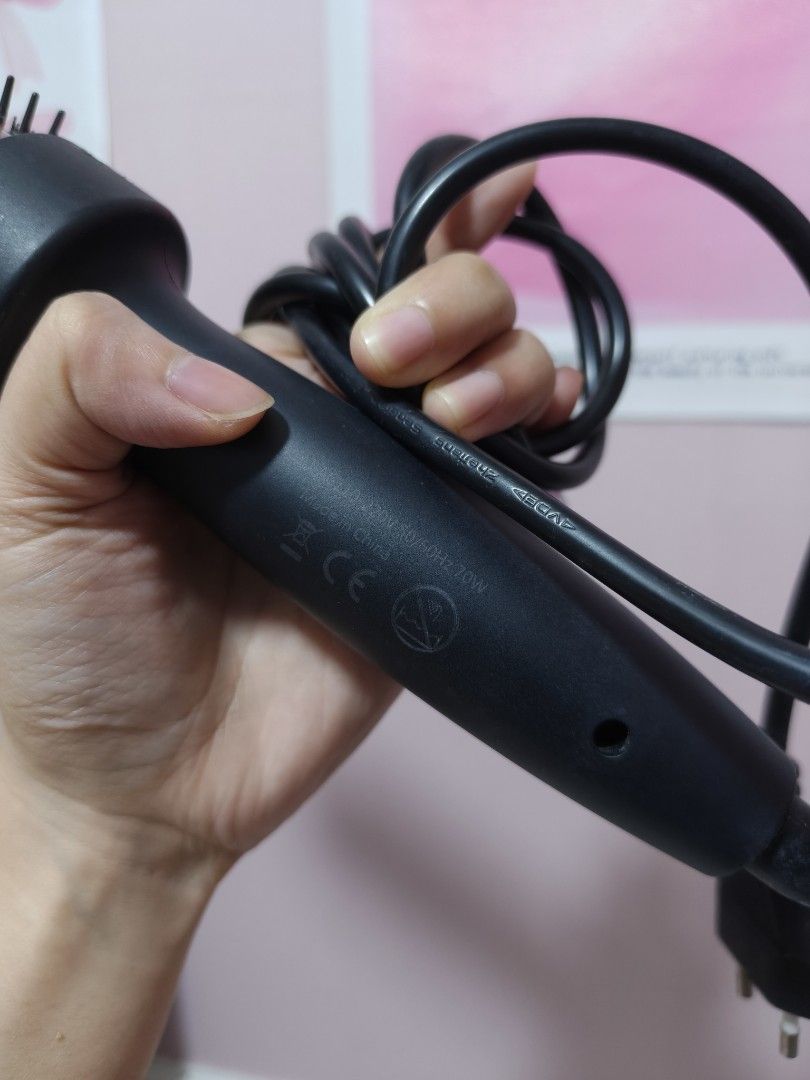 Ubeator Hair curler (Category: Hair) located in Manila. Submitted by lynnn_. (Listing ID 1458215645, Image 3). Description: - Effortlessly style your hair with a rotating barrel for added volume and smooth, sleek locks. - Features firm bristles for effective styling. - Ergonomic design ensures a comfortable and easy grip for hassle-free use. - Comes with a conveniently long cord for ample reach. - Perfect for achieving quick and beautiful blowout