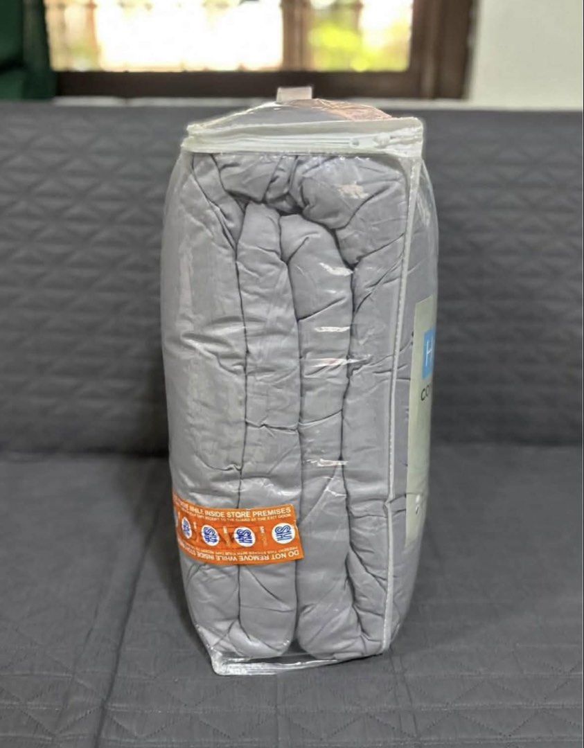 Hosh Comforter Grey Queen Size (Category: Bedding & Towels) located in Tanza. Submitted by sheridaaannpark (Listing ID 1458195197, Image 2). Description: Grey Hosh comforter. Measures 90 inches by 90 inches. Comes in original packaging. Easy to care for, just follow the instructions on the label. Machine washable. Do not bleach or dry clean. Tumble dry low..