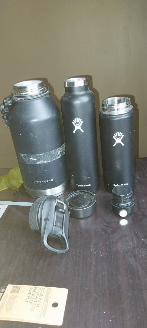 Hydro Flask Water Bottles (3 pcs) (Category: Water Bottles & Tumblers) located in Cainta. Submitted by detheos7 (Listing ID 1458118209, Image 3). Description: - For take all -Set of 3 black Hydro Flask water bottles - Includes one large bottle with a paracord handle - Two standard-sized bottles - Minor scuffs and one bottle has a small dent - Lids are included for all bottles - Excellent for maintaining drink temperature (hot or cold) -needs clea