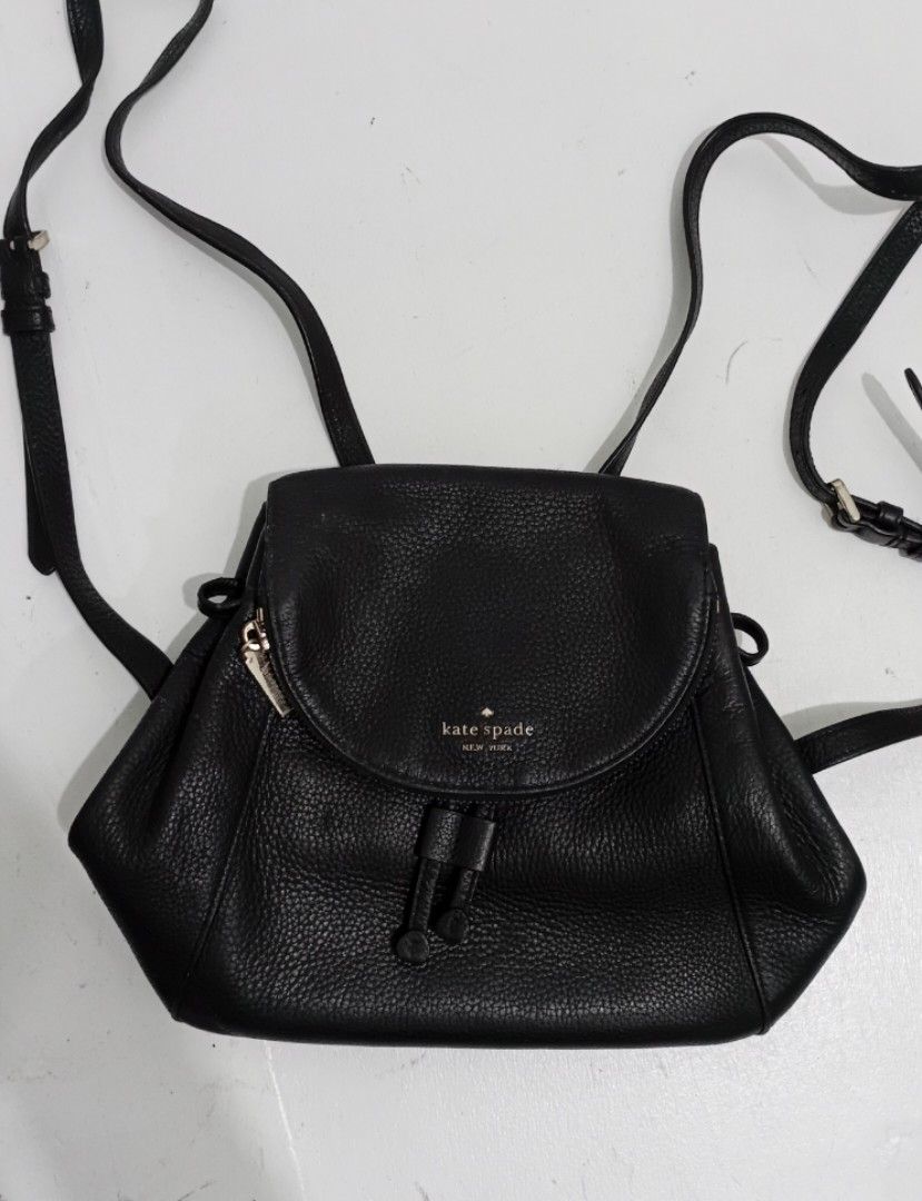 Kate Spade Black Leather Medium Flap Backpack (Category: Luxury Bags & Wallets) located in Navotas City. Submitted by ms.soulana (Listing ID 1458258885, Image 1). Description: PreOwned Lightly Used Authentic Kate Spade black leather backpack - Medium size, ideal for everyday essentials - Secure drawstring closure with a stylish flap top - Interior organization: 1 zip pocket and slip pockets - Comfortable adjustable shoulder straps - Versatile and
