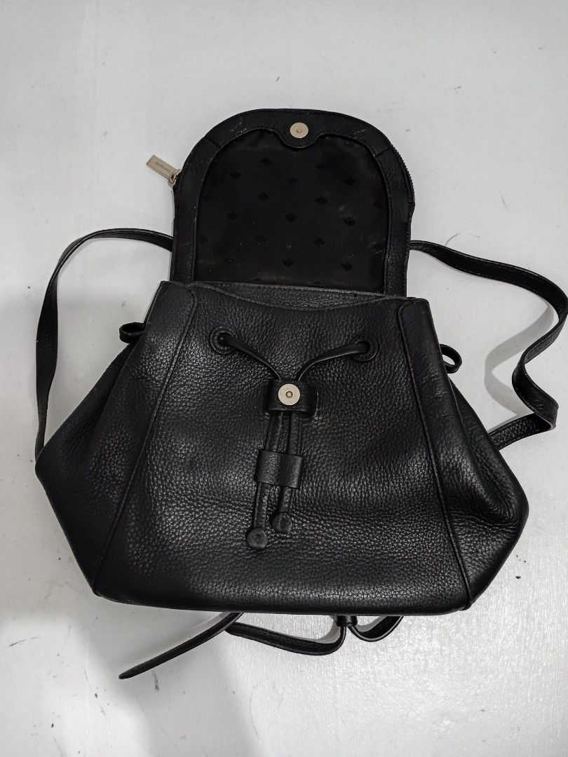 Kate Spade Black Leather Medium Flap Backpack (Category: Luxury Bags & Wallets) located in Navotas City. Submitted by ms.soulana (Listing ID 1458258885, Image 3). Description: PreOwned Lightly Used Authentic Kate Spade black leather backpack - Medium size, ideal for everyday essentials - Secure drawstring closure with a stylish flap top - Interior organization: 1 zip pocket and slip pockets - Comfortable adjustable shoulder straps - Versatile and