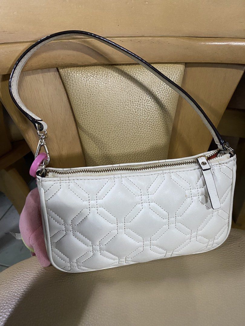 Kate Spade White Quilted Leather Shoulder Bag (Category: Luxury Bags & Wallets) located in Binan City. Submitted by casseyshoppe (Listing ID 1458106153, Image 2). Description: - Brand: Kate Spade - Color: White - Material: Leather - Design: Quilted diamond pattern - Closure: Zipper - Strap: Single strap with a small pink accent detail - Versatile: Ideal for everyday use or a night out Needs cleaning Payment first thru gcash Shipping: j&t or lalam