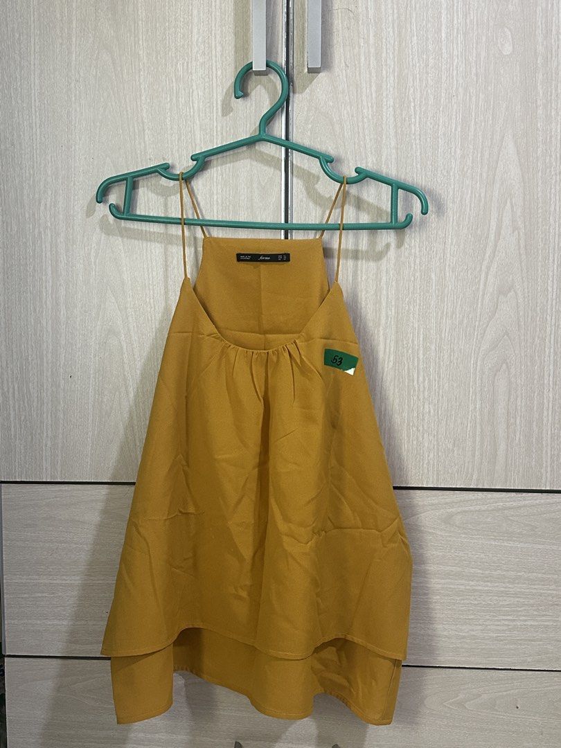 Layered Camisole Top Mustard Yellow (Category: Sleeveless) located in Taguig. Submitted by ibsss (Listing ID 1458238127, Image 3). Description: - Woman camisole top - Mustard yellow color and Navy Green - Layered design - Spaghetti straps - Estimated size: XL - Versatile for casual or dressed-up looks Size: 106cm bust.