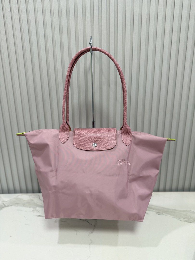 LC medium size (Category: Tote Bags) located in Manila. Submitted by sky_shansai_sumer (Listing ID 1458111246, Image 3). Description: Its a preloved/used bag Medium size,petal pink color Longchamp green series 9.5/10 condition Location: cebu city Note:this is original/authentic, but authenticity is not professionally guaranteed by the seller. Buyers are required to conduct their own research and self-authenticate the item to their satisfaction be
