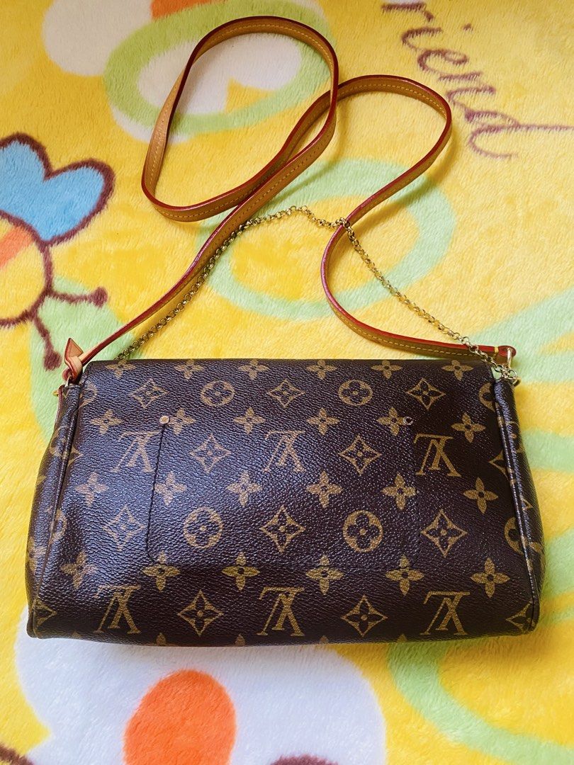 Louis Vuitton favorite (Category: Luxury Bags & Wallets) located in San Jose del Monte. Submitted by cityhanter007 (Listing ID 1458156429, Image 2). Description: - Classic Louis Vuitton monogram canvas crossbody bag - some tarnish/fading on hardware - Burgundy fabric interior with a small pocket - Leather and chain combination strap - coded -yung magnet lock nya di na masyado madikit .
