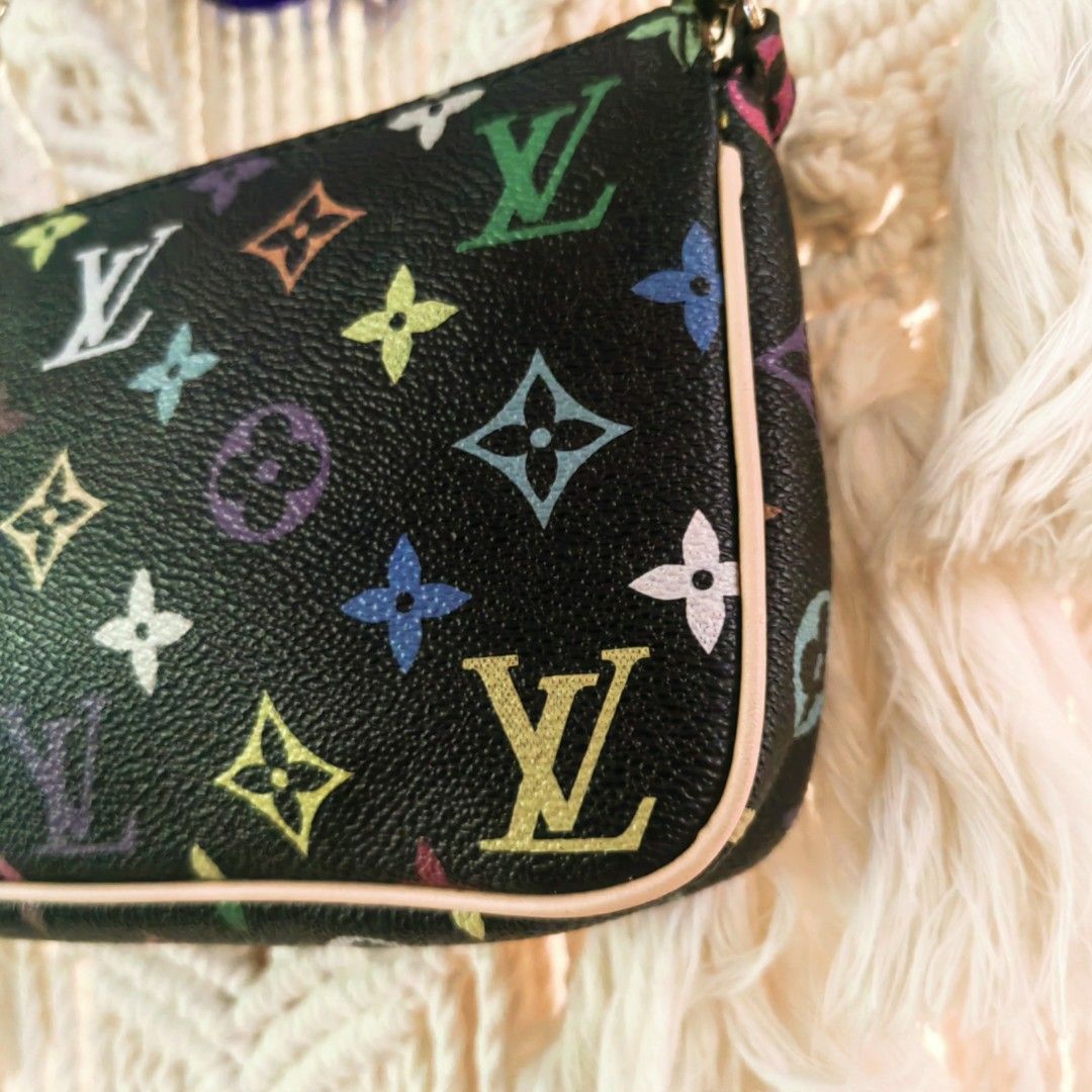 Louis Vuitton Monogram Multicolore Pochette (Category: Luxury Bags & Wallets) located in Davao. Submitted by gelleevanelli (Listing ID 1458156082, Image 2). Description: *Louis Vuitton Monogram Multicolor Pochette * - this is THE collector's piece! *Bag Details from photos:* *Model*: LV Pochette Accessoires - Monogram Multicolor "Noir" *Era*: 2003-2015 - iconic collaboration - *Color*: Black base with 33 rainbow colors. This is the "Noir" colorwa