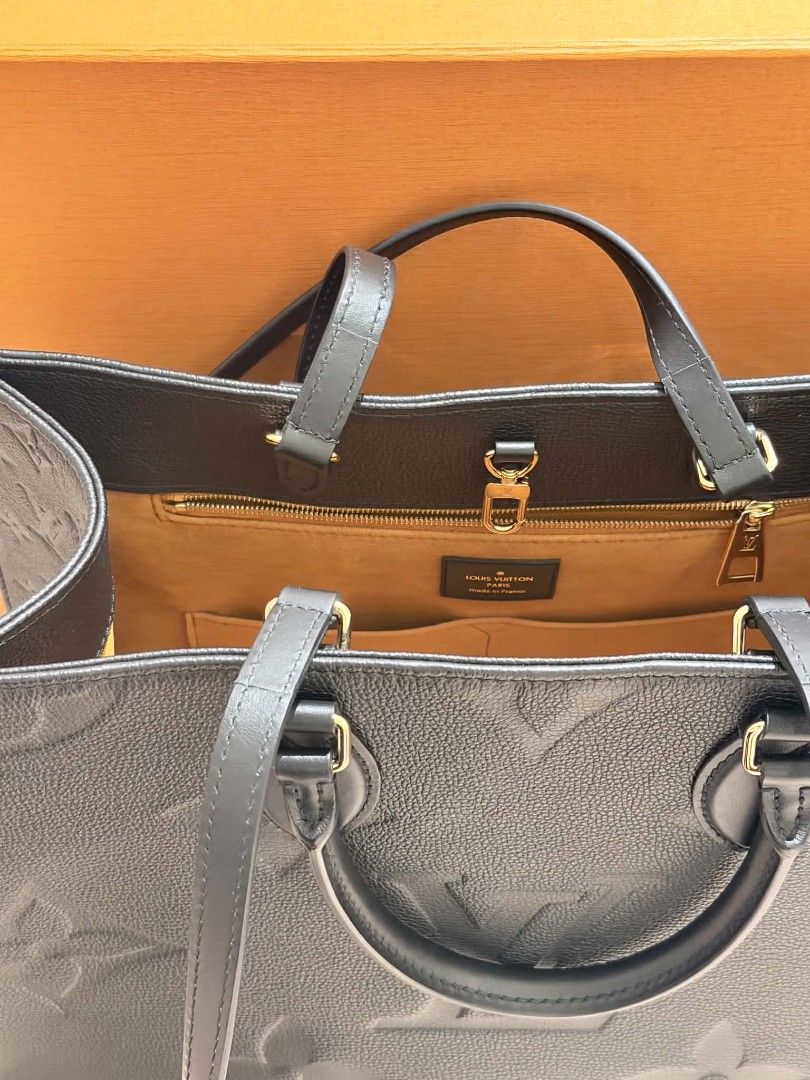 Louis Vuitton OnTheGo MM Black Monogram Empreinte Leather (Category: Luxury Bags & Wallets) located in Quezon. Submitted by jarcinz0513 (Listing ID 1458219950, Image 2). Description: - Authentic Louis Vuitton OnTheGo MM Tote Bag - Material: Black Monogram Empreinte Leather - Spacious interior with zip pocket and compartments - Includes original dust bag and box - Purchase receipt available (bought in Singapore) - Ideal for daily use and travel FS