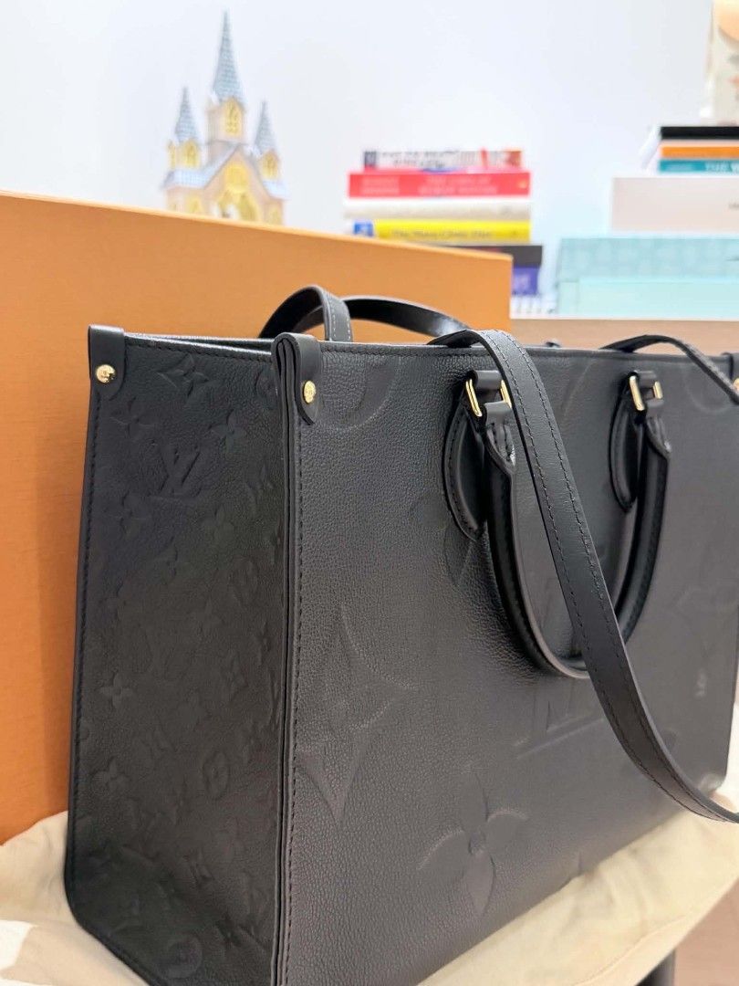 Louis Vuitton OnTheGo MM Black Monogram Empreinte Leather (Category: Luxury Bags & Wallets) located in Quezon. Submitted by jarcinz0513 (Listing ID 1458219950, Image 1). Description: - Authentic Louis Vuitton OnTheGo MM Tote Bag - Material: Black Monogram Empreinte Leather - Spacious interior with zip pocket and compartments - Includes original dust bag and box - Purchase receipt available (bought in Singapore) - Ideal for daily use and travel FS