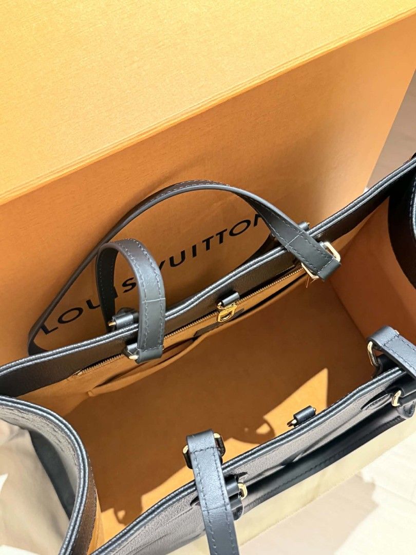 Louis Vuitton OnTheGo MM Black Monogram Empreinte Leather (Category: Luxury Bags & Wallets) located in Quezon. Submitted by jarcinz0513 (Listing ID 1458219950, Image 3). Description: - Authentic Louis Vuitton OnTheGo MM Tote Bag - Material: Black Monogram Empreinte Leather - Spacious interior with zip pocket and compartments - Includes original dust bag and box - Purchase receipt available (bought in Singapore) - Ideal for daily use and travel FS