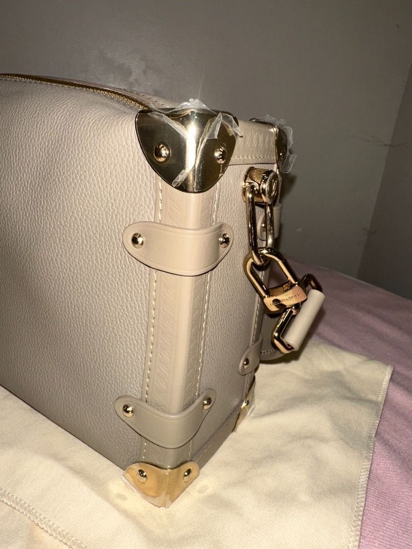LOUIS VUITTON SIDE TRUNK MM IN TAUPE (Category: Clutches) located in Naga. Submitted by loveklarra_689 (Listing ID 1458199150, Image 2). Description: LOUIS VUITTON SIDE TRUNK MM IN TAUPE Made from grained calf leather with smooth cowhide-leather trim, it features an S-lock and reinforced metallic corners. The removable handle enables hand carry while the detachable and adjustable leather strap adjusts for shoulder and cross-body wear. ✓ Brand new