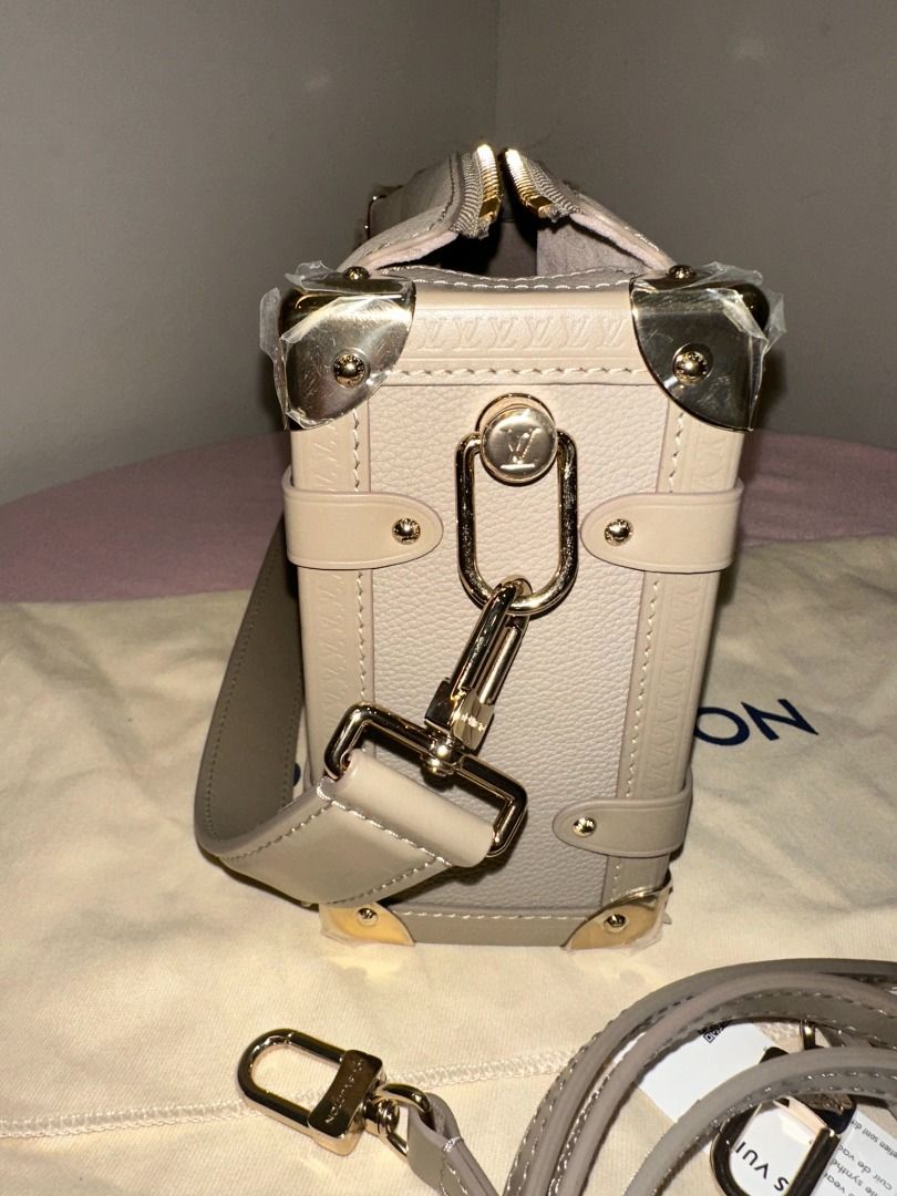 LOUIS VUITTON SIDE TRUNK MM IN TAUPE (Category: Clutches) located in Naga. Submitted by loveklarra_689 (Listing ID 1458199150, Image 3). Description: LOUIS VUITTON SIDE TRUNK MM IN TAUPE Made from grained calf leather with smooth cowhide-leather trim, it features an S-lock and reinforced metallic corners. The removable handle enables hand carry while the detachable and adjustable leather strap adjusts for shoulder and cross-body wear. ✓ Brand new