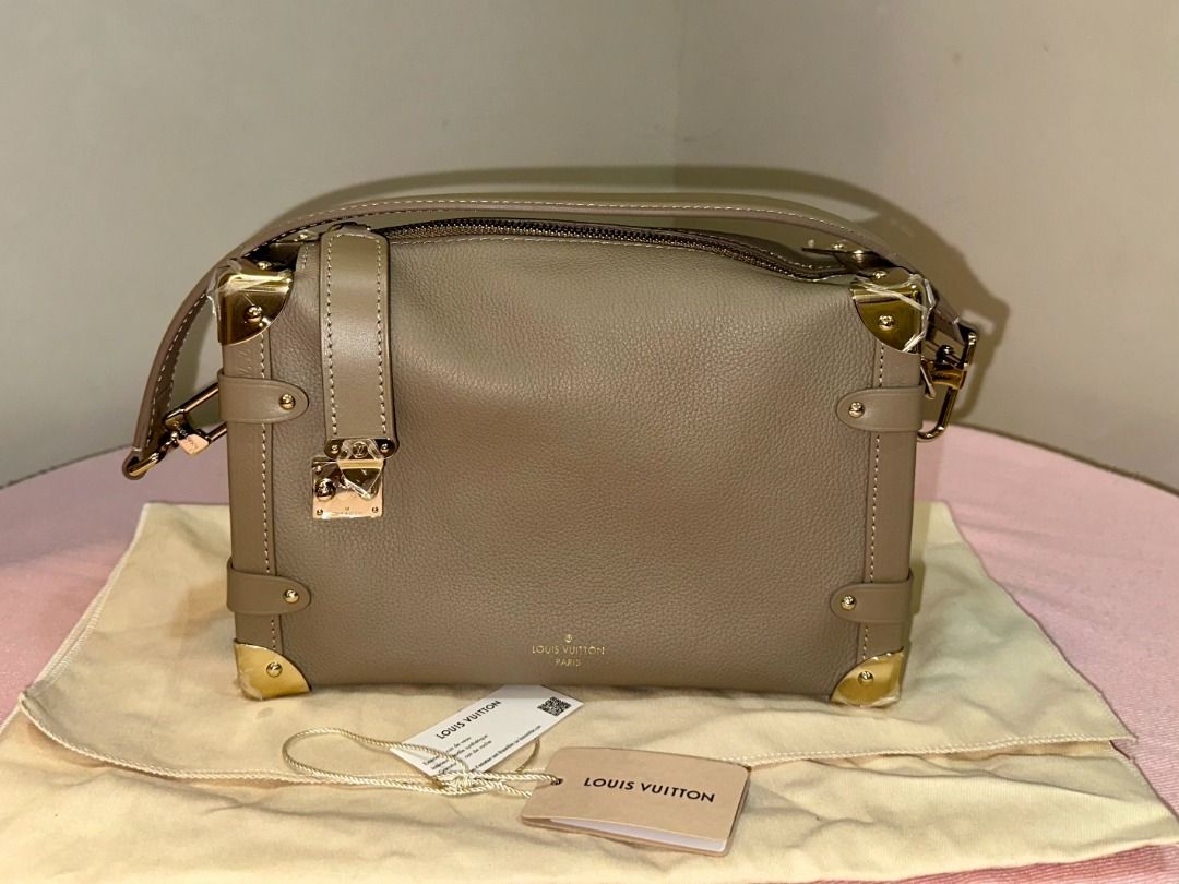 LOUIS VUITTON SIDE TRUNK MM IN TAUPE (Category: Clutches) located in Naga. Submitted by loveklarra_689 (Listing ID 1458199150, Image 1). Description: LOUIS VUITTON SIDE TRUNK MM IN TAUPE Made from grained calf leather with smooth cowhide-leather trim, it features an S-lock and reinforced metallic corners. The removable handle enables hand carry while the detachable and adjustable leather strap adjusts for shoulder and cross-body wear. ✓ Brand new