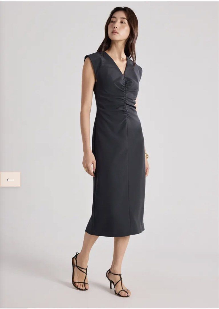 Love Bonito Dress (Category: Dresses) located in Manila. Submitted by jdddecluttersss (Listing ID 1458220525, Image 2). Description: - Elegant midi dress in dark charcoal or black. - Flattering V-neck with ruched detailing. - Structured cap sleeves. - Fabric with a subtle sheen. - Versatile for dressing up or down..