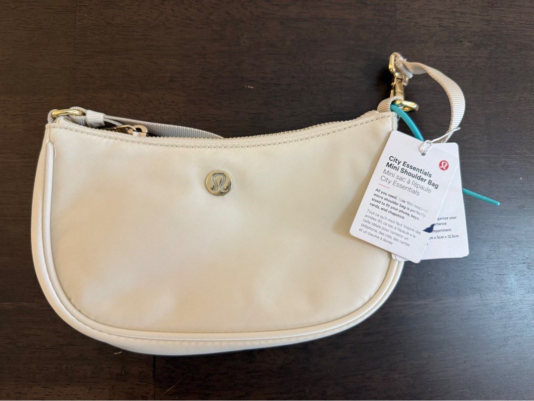 Lululemon City Essentials Mini Shoulder Bag 1L Cream (Category: Shoulder Bags) located in Manila. Submitted by kaiatphnow (Listing ID 1458117255, Image 1). Description: - Brand new Lululemon City Essentials Mini Shoulder Bag - Color: Cream - Capacity: 1L - Features: Zipper closure, small strap - Condition: Original tags attached - Ideal for: Carrying your daily essentials.