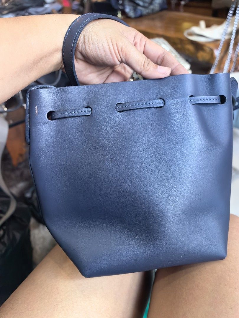 Mansur Gavriel Navy Leather Bucket Bag (Category: Luxury Bags & Wallets) located in Cagayan de Oro. Submitted by tommygurl1218 (Listing ID 1458108193, Image 3). Description: - Authentic Mansur Gavriel navy blue leather bucket bag - Secure drawstring closure - Adjustable shoulder strap with elegant gold-tone hardware - Classic, minimalist design - Ideal for everyday wear and tear With minimal sign of use .