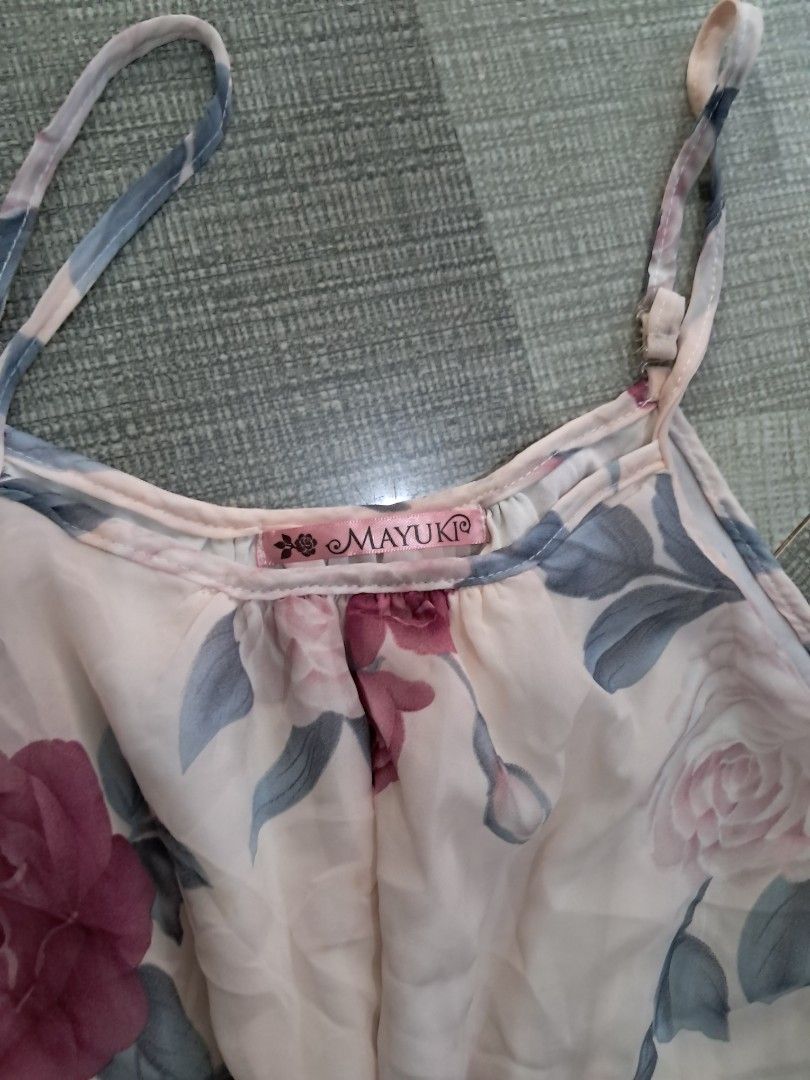 MAYUKO Floral Print Ruffle Camisole Top (Category: Sleeveless) located in Manila. Submitted by chill_zy (Listing ID 1458108519, Image 2). Description: - Cute floral print camisole top - Features a ruffled hemline - Adjustable straps for a perfect fit - Light and flowy material - Versatile: great for layering or wearing alone - Suitable for casual or dressy looks.