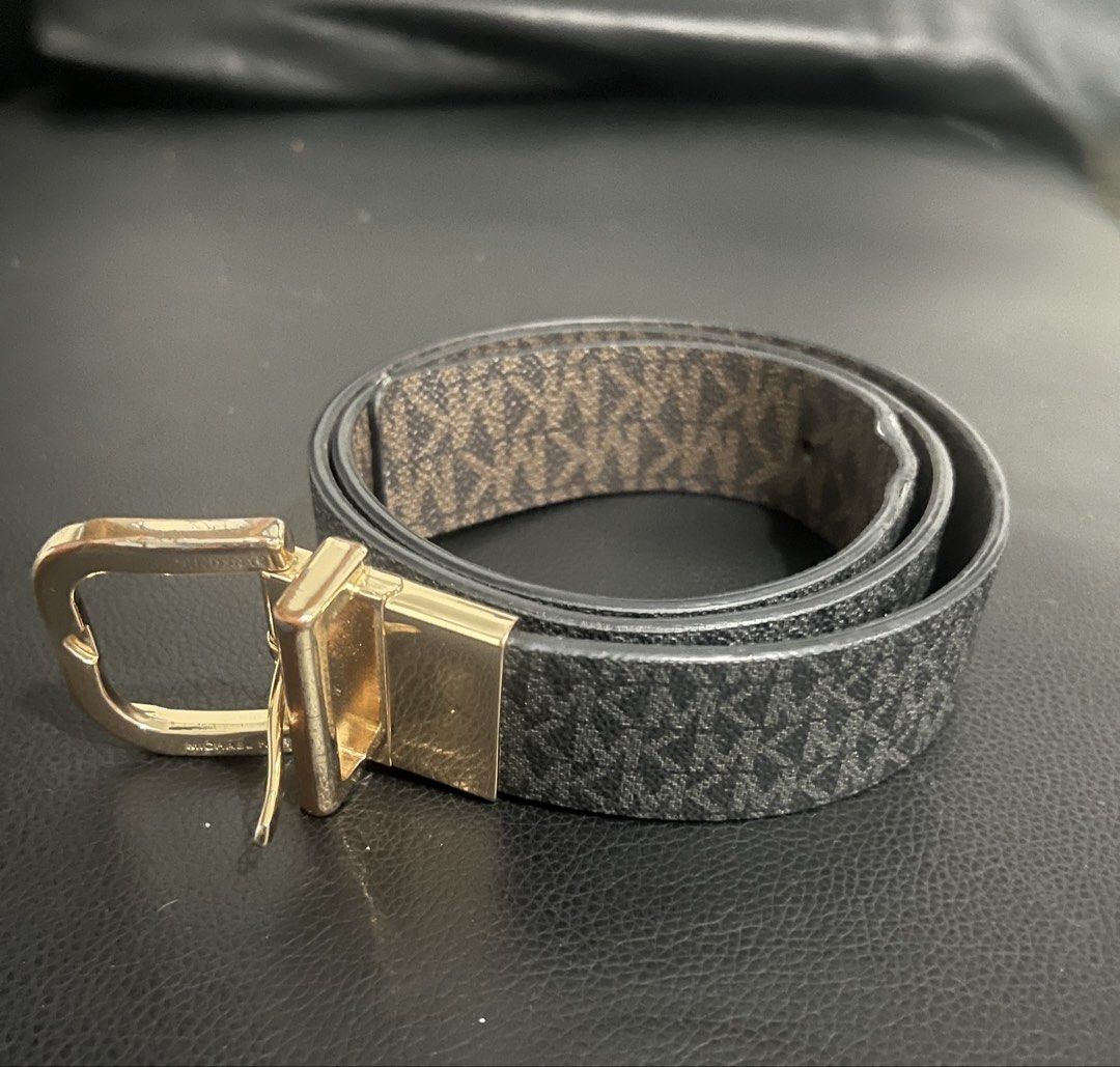 MK Reversible Belt (Category: Belts) located in San Pablo. Submitted by celgvr (Listing ID 1458295631, Image 2). Description: - MK Reversible Belt - Features a classic MK monogram pattern on one side - Offers a solid color option on the reverse side - Accented with a stylish gold-tone buckle - A versatile accessory to complement various outfits.