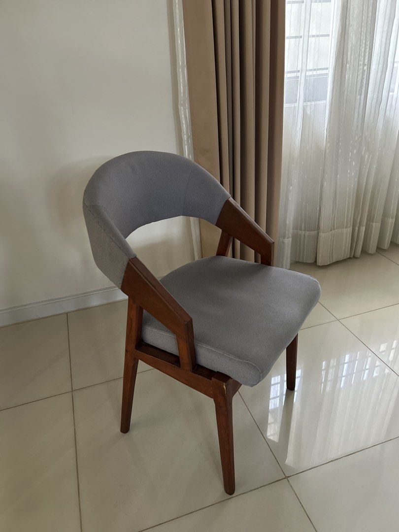 Modern Grey Upholstered Dining Chair with Solid Wooden Frame (Category: Chairs) located in Antipolo. Submitted by vsioson (Listing ID 1458218056, Image 1). Description: Elegant & Sturdy Solid Wood Dining Chairs ✨ 8 Dining Chairs Available 💰 ₱3,800 each 8 chairs available — can be sold as whole set or by twos or fours. Well-maintained and in good condition Recently deep-cleaned and ready to use! 🪑 Solid wood construction 🤍 Classic grey fabric u