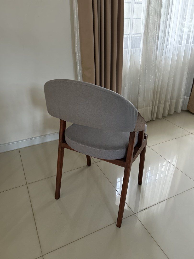 Modern Grey Upholstered Dining Chair with Solid Wooden Frame (Category: Chairs) located in Antipolo. Submitted by vsioson (Listing ID 1458218056, Image 2). Description: Elegant & Sturdy Solid Wood Dining Chairs ✨ 8 Dining Chairs Available 💰 ₱3,800 each 8 chairs available — can be sold as whole set or by twos or fours. Well-maintained and in good condition Recently deep-cleaned and ready to use! 🪑 Solid wood construction 🤍 Classic grey fabric u