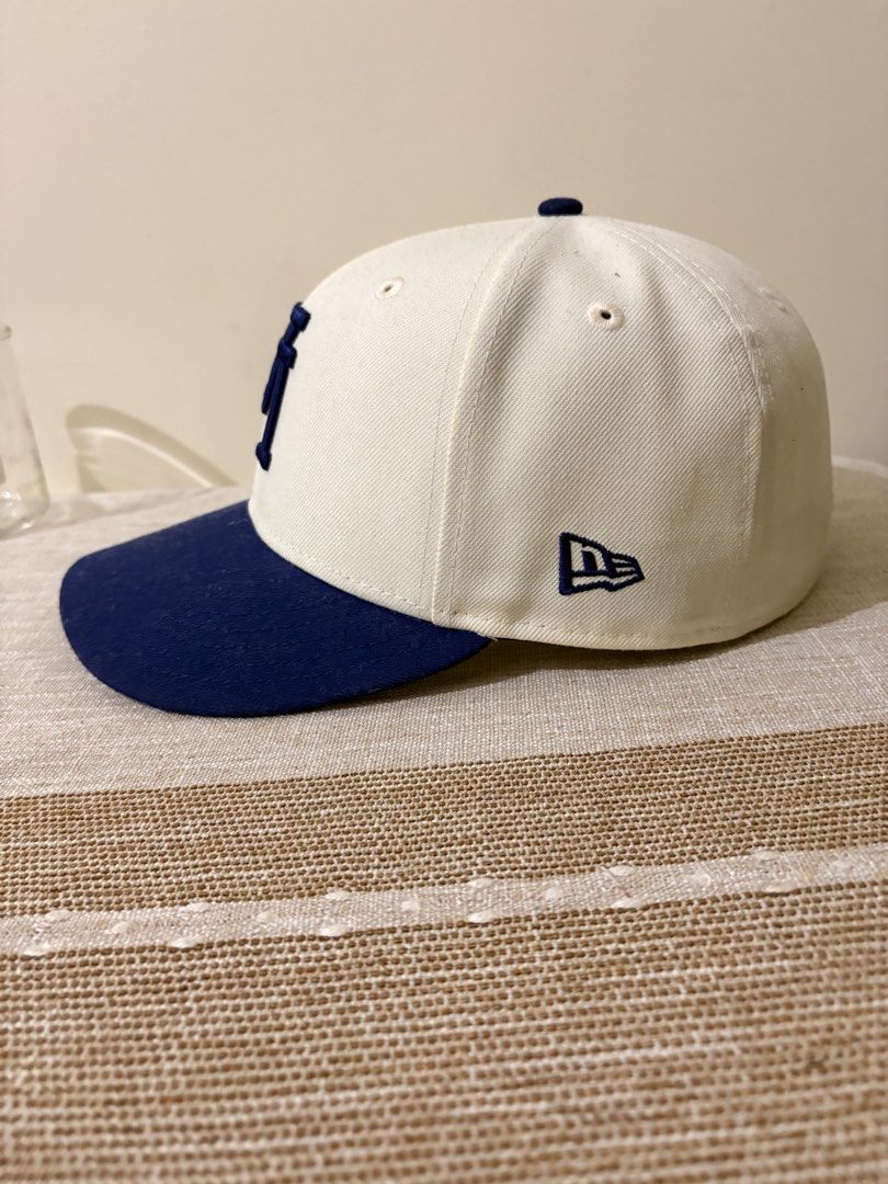 New Era 59FIFTY LA Dodgers Upside Down Fitted Cap (Category: Caps & Hats) located in Santa Rosa. Submitted by charles2002 (Listing ID 1458158852, Image 2). Description: - New Era 59FIFTY Fitted Cap - Team: LA Dodgers - Color: White and Royal Blue - Features: LA Dodgers logo (front), New Era logo (side), MLB logo (back) - Size: 7 1/4.