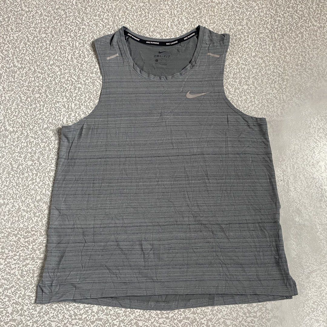 Nike Running Tank Top with Reflective Logo (Category: Activewear) located in Cabuyao City. Submitted by stuffwarsph (Listing ID 1458098156, Image 1). Description: Nike Running Tank Top with Reflective Logo Small on tag Width 18 Length 24.5 Good as new 10/10 Color rate No issues ₱400.