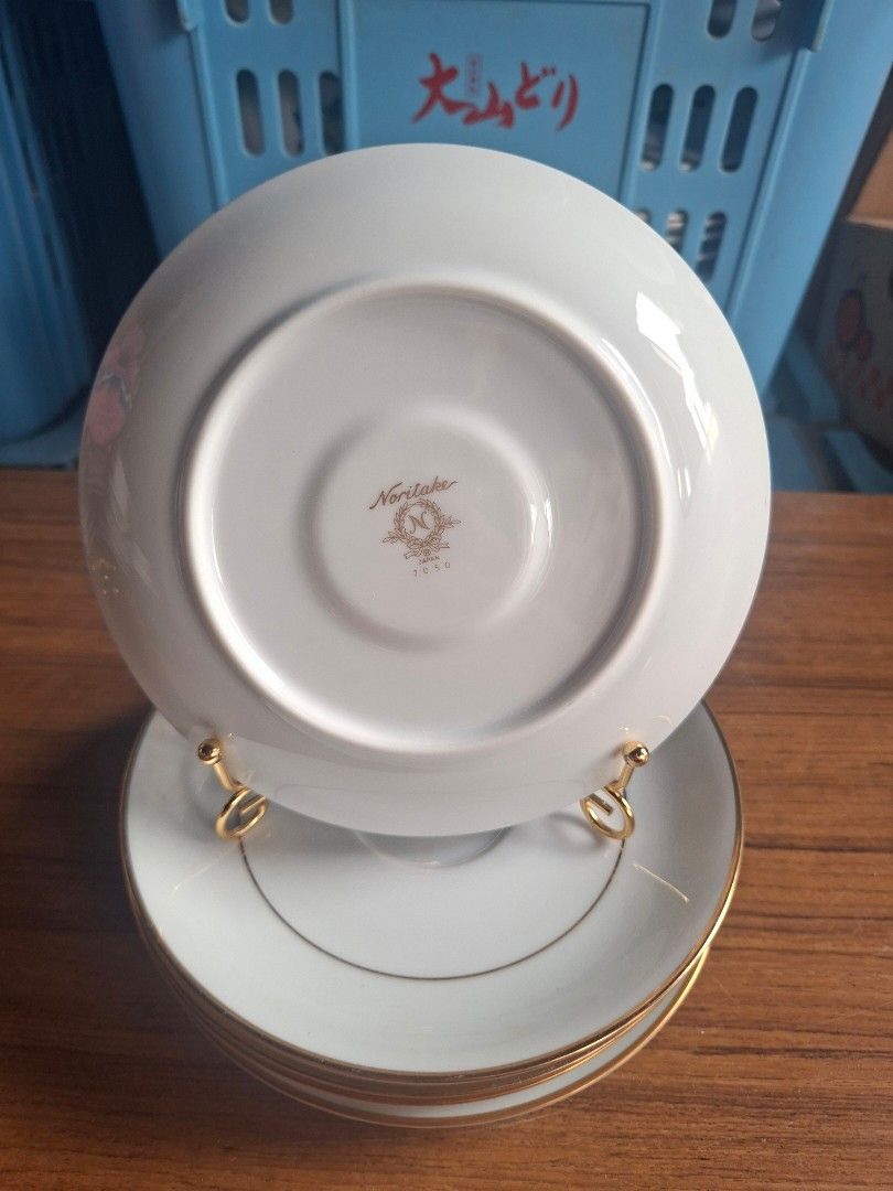 Noritake Saucers Set of 5 (Category: Dinnerware & Cutlery) located in Consolacion. Submitted by luxekerei (Listing ID 1458182299, Image 2). Description: - a stack of white porcelain saucers accented with delicate gold-tone trim rings. - 16cm in diameter.