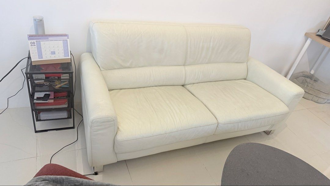 Off White Genuine Leather Sofa (Category: Sofas) located in Makati City. Submitted by je.luxe.life (Listing ID 1458184151, Image 3). Description: 2-3 seater sofa in off white genuine leather. IDC Otsuka brand, their sofas retail for Php100k+ minimum. Rush + has flaws (peeling, dry leather) on few areas hence the low price. Rfs: migrating.