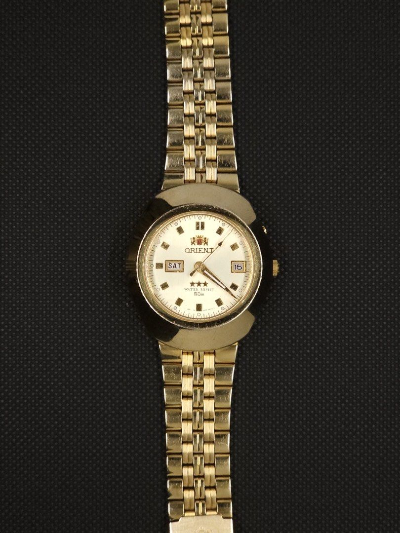 [1998] Orient 3 Star (Category: Men's Watches) located in San Jose. Submitted by midnightwatchersph (Listing ID 1458226627, Image 2). Description: [1998] Orient 3 Star Automatic Watch Gold Dial Diamond Cut Glass (Faceted glass) Orient Japan Automatic Movement Original Orient gold plated strap 40mm case size (excluding screw down crown) All original. Fits up to 8 in wriest ✨ 9/10 condition 💸PRICE: 6500.