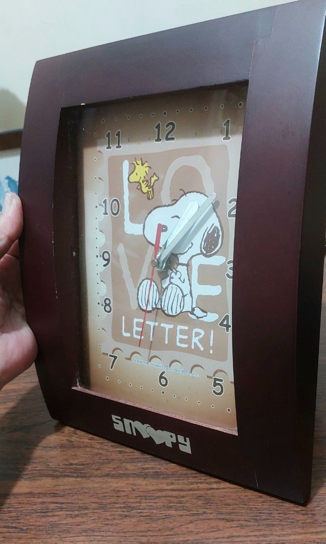 Peanut Snoopy Wooden Wall Clock (Category: Clocks) located in Calamba. Submitted by myhomeshop_ph (Listing ID 1458252829, Image 3). Description: Peanuts Snoopy and Woodstock "Love Letter!" wooden wall clock. Built with a rectangular dark brown wooden frame. Analog quartz , battery operated. Calamba Laguna.