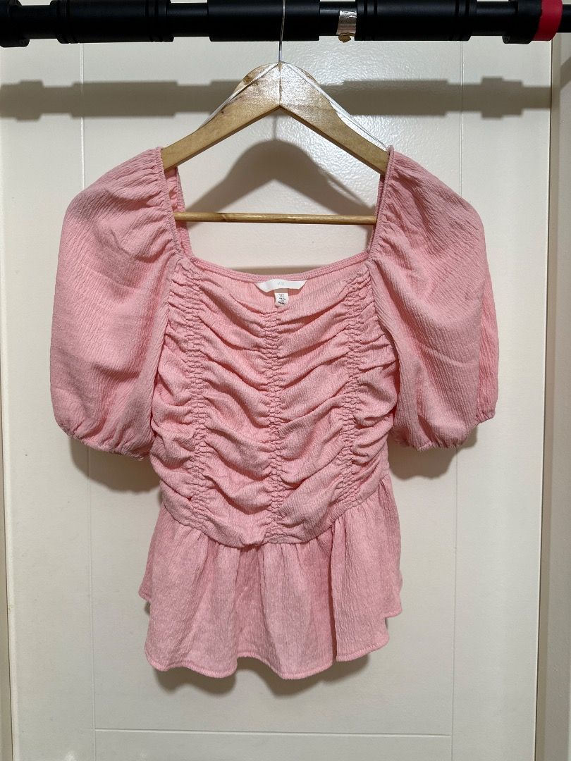 Pink Square Neck Ruched Peplum Top (Category: Sleeveless) located in Mandaluyong City. Submitted by lovedbyjaaaam (Listing ID 1458167823, Image 1). Description: - Cute pink top - Square neckline - Ruched front detail - Flattering peplum hem - Puffed sleeves - Textured fabric - Versatile: pairs well with jeans or skirts.