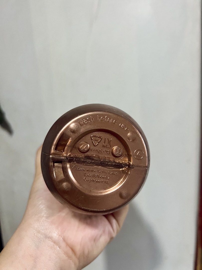 Pop Cycling Co Bronze Water Bottle (Category: Water Bottles & Tumblers) located in Taytay. Submitted by dezaaaa (Listing ID 1458296438, Image 2). Description: - Bronze water bottle with a fun white pattern. - Features a secure screw-on lid with a convenient pull-up spout. - Made of durable plastic, perfect for hydration on the go. - Bottom has markings, including 'wash before use'..