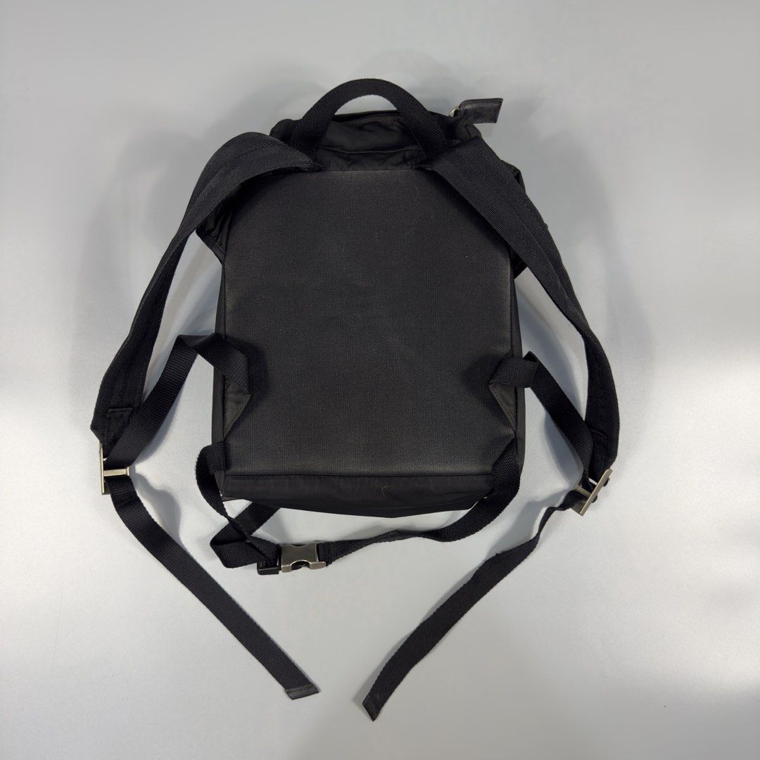 Prada - Tessuto Mini Nylon Backpack (Category: Luxury Bags & Wallets) located in Dasmarinas. Submitted by F_A_Q (Listing ID 1458150915, Image 2). Description: Size : - 12 In. Width - 14 In. Length 8.5/10 Overall usage Check details for the issue .