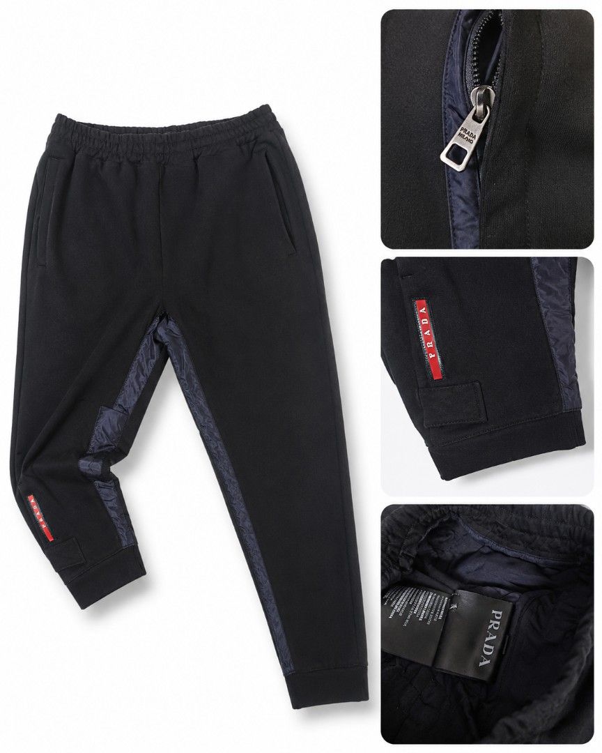 Prada Black Track Pants with Blue Side Detail (Category: Joggers) located in Cabanatuan. Submitted by laizamhar22 (Listing ID 1458108357, Image 1). Description: - Authentic Black Prada Track Pants - Unique Blue Quilted Side Panel Detail - Convenient Side Zipper Pocket with Branded Pull Tab - Subtle Prada Logo Tag on Lower Leg - Comfortable Elastic Waistband with Adjustable Drawstring - Designed for a Relaxed and Comfortable Fit.