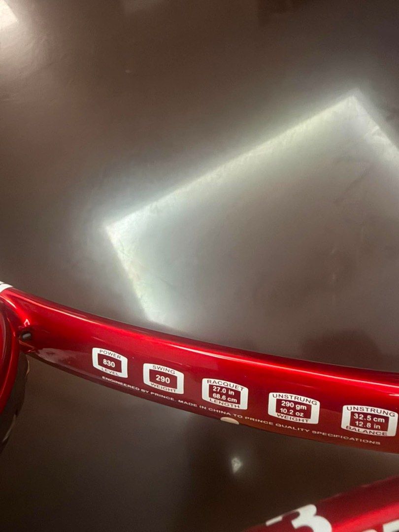 Prince Tennis Racquet - Red (Category: Racket and Ball Sports) located in Cavite. Submitted by grecegalang (Listing ID 1458228908, Image 2). Description: Prince 003 weight 290 head size 100 almost new yan with new grip tape na.