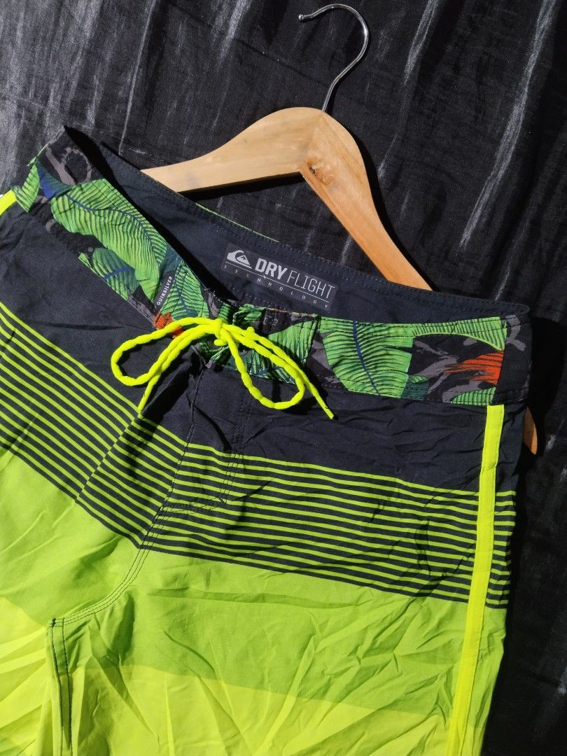 Quiksilver Board Shorts - Dry Flight Technology (Category: Shorts) located in Digos. Submitted by kyle_curation.ph (Listing ID 1458229517, Image 3). Description: - Quiksilver board shorts - 28×18 Dimension - Dry Flight technology - Tropical leaf print waistband - Bold striped leg pattern - Color: Bright lime green and black - Lace-up front closure - Small zip pocket on the back - Ideal for swimming or surfing.