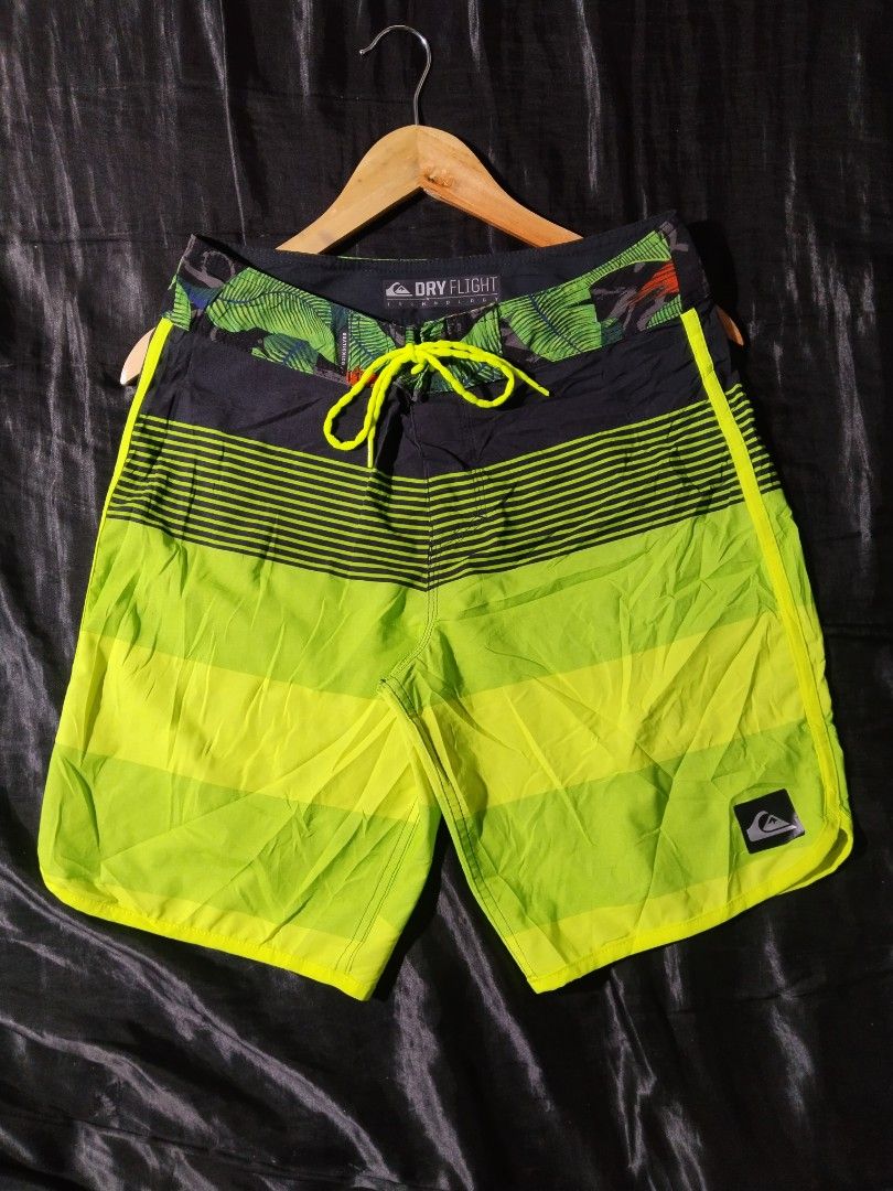 Quiksilver Board Shorts - Dry Flight Technology (Category: Shorts) located in Digos. Submitted by kyle_curation.ph (Listing ID 1458229517, Image 1). Description: - Quiksilver board shorts - 28×18 Dimension - Dry Flight technology - Tropical leaf print waistband - Bold striped leg pattern - Color: Bright lime green and black - Lace-up front closure - Small zip pocket on the back - Ideal for swimming or surfing.