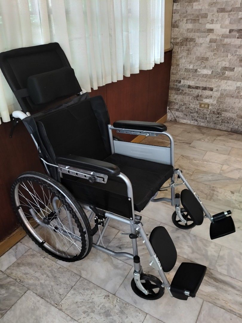 Reclining Wheelchair with Commode Seat (Category: Wheelchairs) located in Manila. Submitted by newmoon-e25b (Listing ID 1458266852, Image 1). Description: - Comfortable reclining backrest and headrest - Removable commode seat for convenience - Padded armrests for comfort - Adjustable footrests for a personalized fit - Large rear wheels for stability and maneuverability - Excellent mobility assistance.
