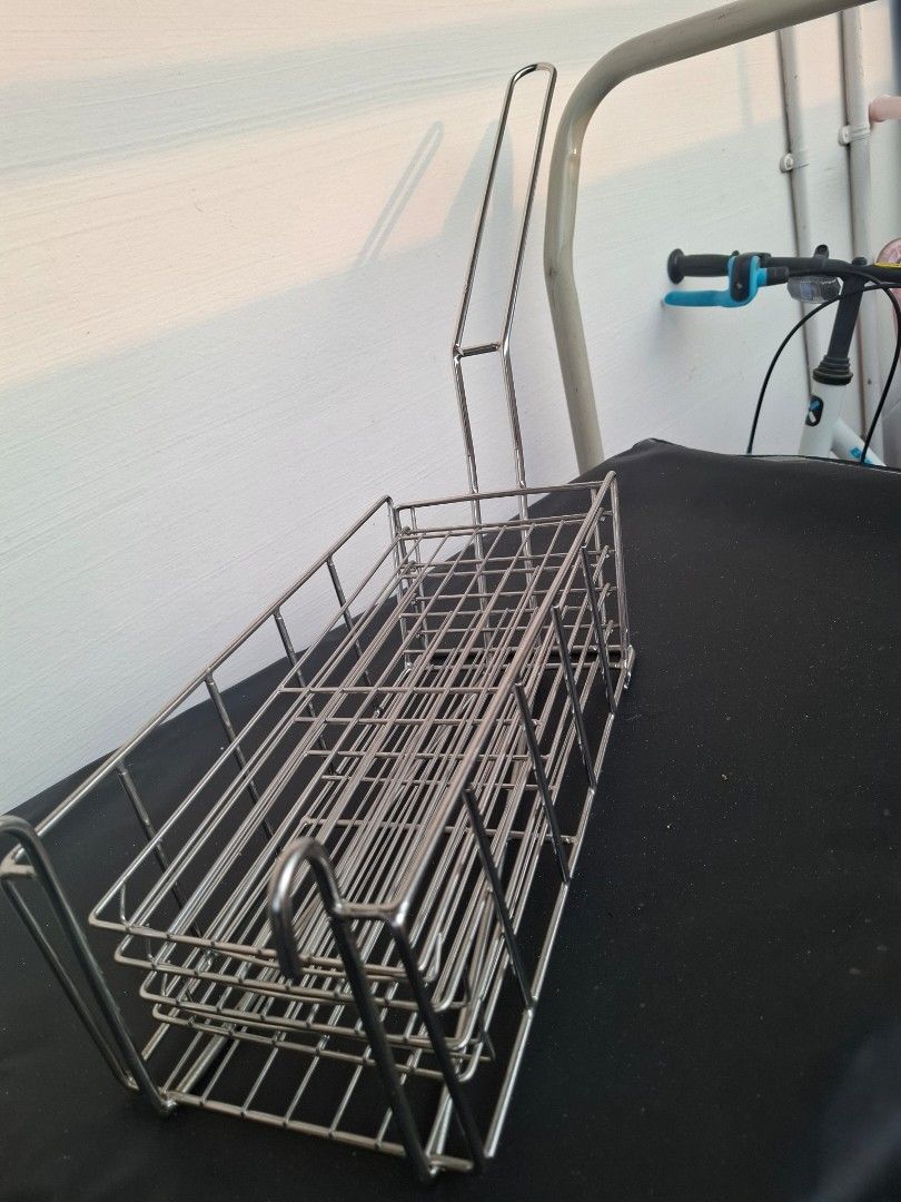 Rectangular frying basket (Category: Fryers) located in Singapore. Submitted by smbala (Listing ID 1458197743, Image 3). Description: Rectangular deep fryer basket made of chrome-plated or stainless steel wire mesh. It is designed to hold food while immersing it into hot cooking oil and draining it afterward. Key Visual Features Wire Mesh Construction: Open grid pattern allows hot oil to flow freely around food for even cooking. Long Angled Handl