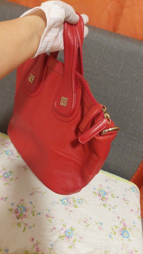 Red Givenchy Leather Tote Bag (Category: Luxury Bags & Wallets) located in Paranaque City. Submitted by daddyu (Listing ID 1458170199, Image 3). Description: - Genuine red leather tote bag - Iconic Givenchy logo hardware - Secure zipper closure - Comfortable top handles - Generous size: approximately 16 inches wide - Ideal for everyday use with ample interior space Free Givenchy Lucky Charm.