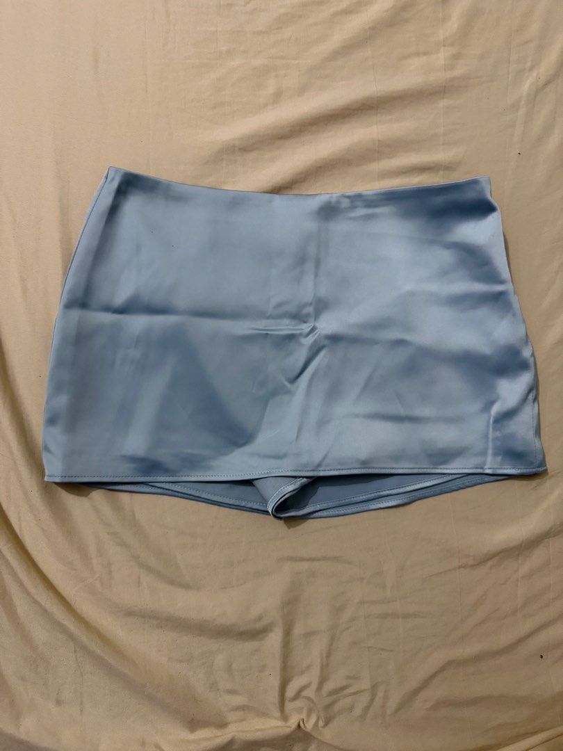 Rubies Studio Erin Skort (Category: Skirts) located in Cavite. Submitted by christianneeee (Listing ID 1458189426, Image 1). Description: - Rubies Studio light blue satin shorts - High-waisted style - Versatile for dressing up or down - Size M - Made in Vietnam - Check measurements if needed.