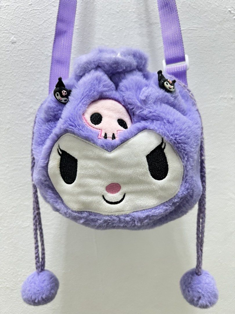 Sanrio Kuromi plush drawstring crossbody bag (Category: Diaper Bags & Wetbags) located in Imus. Submitted by vdc.apparel (Listing ID 1458131513, Image 2). Description: This is fluffy purple Sanrio Kuromi plush drawstring crossbody bag with embroidered facial features and pom-pom pull strings.