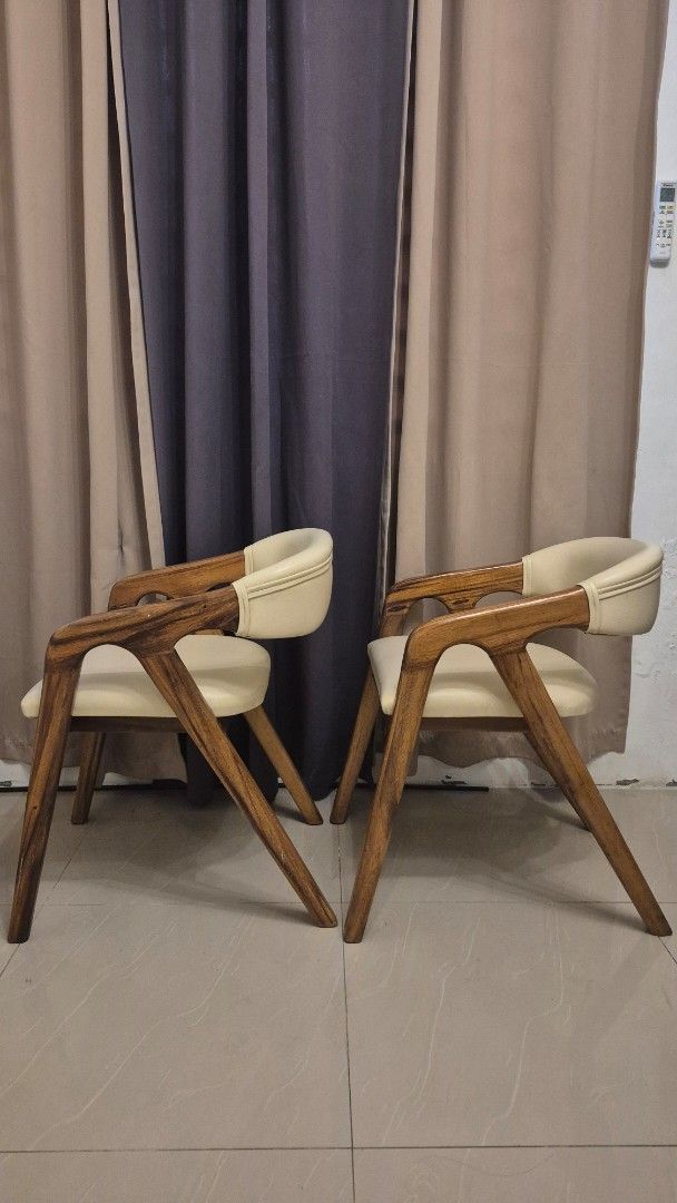 Solid Wood Dining Chairs (Category: Chairs) located in Bacoor. Submitted by jaizalouriz (Listing ID 1458149765, Image 1). Description: selling our dining chairs. aesthetic solid wood - mabigat po ito price per piece po is 4800. even in malls mahal po dining chairs nila, not wood pa po yun. willing to negotiate but wag po lowball masyado, I love these chairs but can't bring to our condo. Loc: Bacoor .