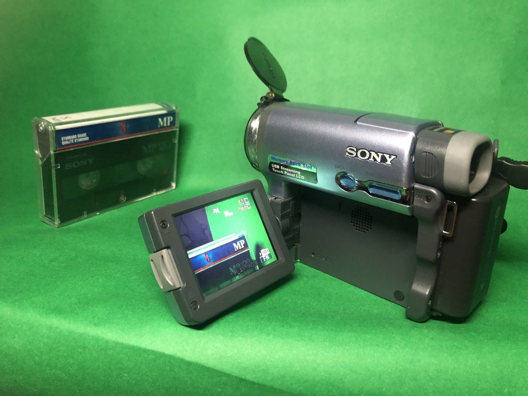 Sony DCR-TRV22 MiniDV Handycam — Mint (Category: Video Cameras) located in Manila. Submitted by cre8tives (Listing ID 1458274831, Image 2). Description: Sony DCR-TRV22 MiniDV Handycam — Mint * Mint condition with minor cosmetic scratches * Tape deck working properly * Viewfinder not working * Great for MiniDV / retro video * Comes with original box * Includes battery + charger .