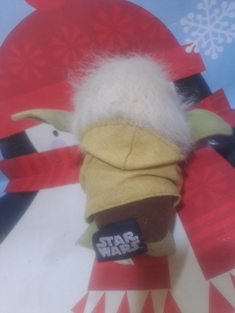 Star Wars Yoda Plush Toy (Category: Plushies & Soft Toys) located in Davao. Submitted by bravemoon_556cd5 (Listing ID 1458192777, Image 2). Description: - Adorable Yoda plush toy from Star Wars. - Made with soft and cuddly material. - Features the official Star Wars tag on the back. - Ideal for any Star Wars enthusiast. - Great for both display and playtime..
