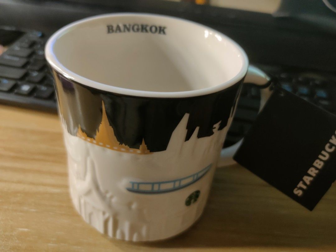 Starbucks Bangkok Relief Mug (Category: Coffee & Tea Tableware) located in Manila. Submitted by hrh123 (Listing ID 1458269943, Image 1). Description: - Authentic Bangkok Starbucks mug. Bought in Thailand. - Features a detailed relief of the Bangkok city skyline - Showcases iconic landmarks like Rama VIII Bridge and Wat Arun - Comes with its original tag attached .