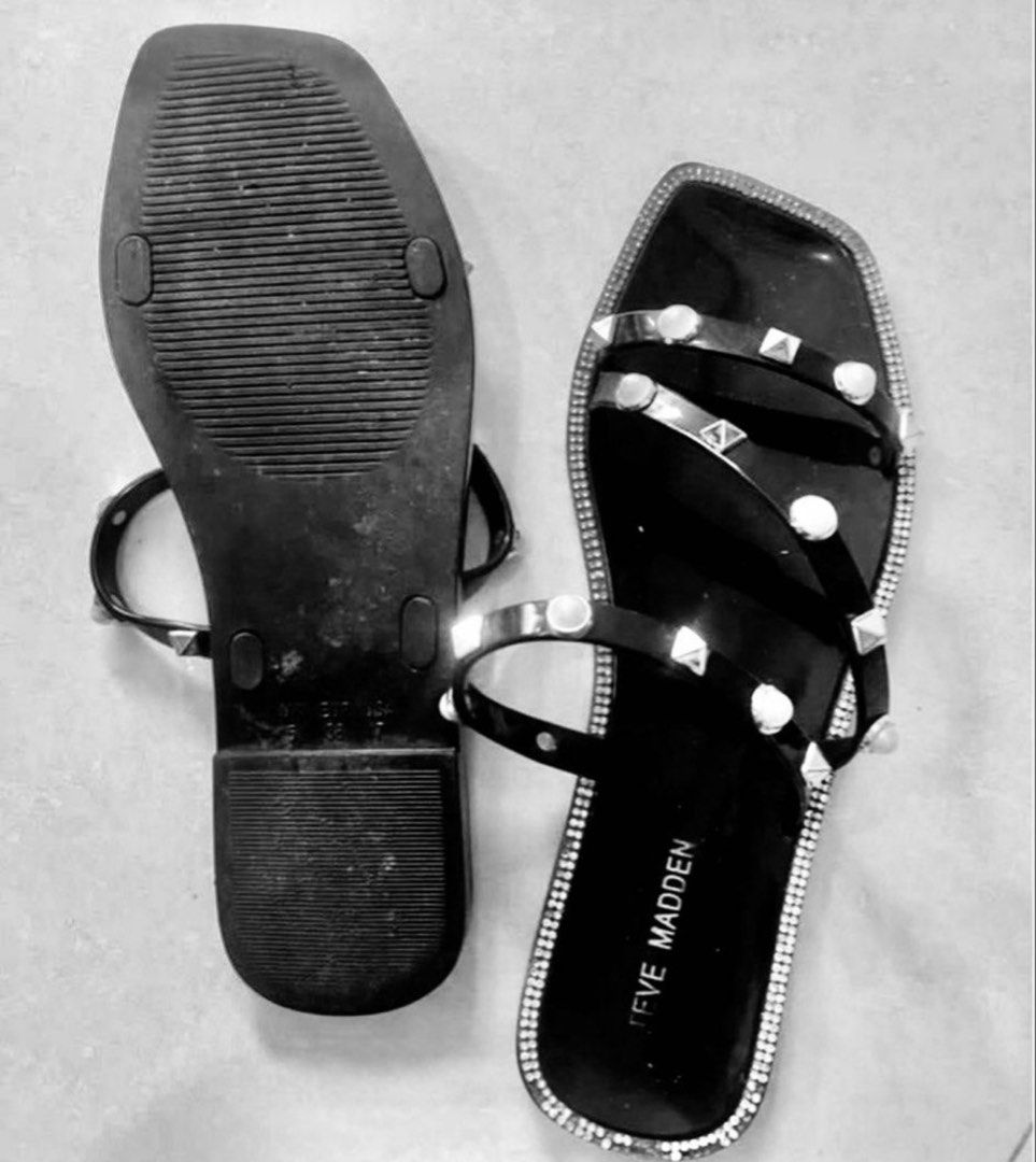 Steve madden sandals (Category: Flats & Sandals) located in Manila. Submitted by bornthisway22 (Listing ID 1458203420, Image 3). Description: Black Steve Madden sandals with studded details. Features a square toe design and clear straps. The sandals have a rhinestone trim around the edges. The brand name is visible on the insole. Actual Picture poster.