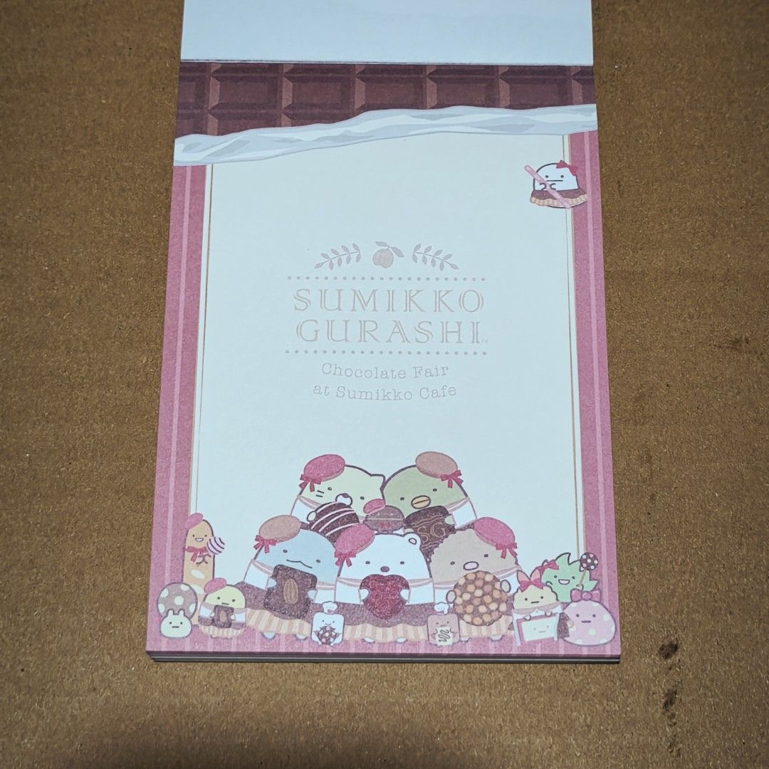 Sumikko Gurashi Chocolate Fair Notepad (Category: Stationery & School Supplies) located in Manila. Submitted by abbey.lee (Listing ID 1458206872, Image 2). Description: Cute Sumikko Gurashi notepad with a chocolate theme. Features various characters enjoying desserts. Great for jotting down notes or as a gift for fans. Plenty of pages for writing. Fun designs on each page. Perfect for school or personal use..