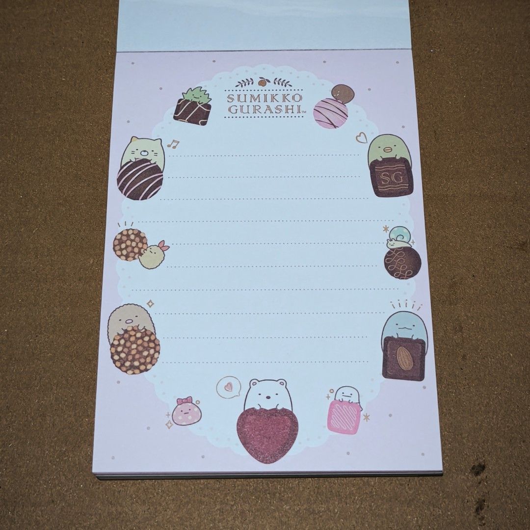 Sumikko Gurashi Chocolate Fair Notepad (Category: Stationery & School Supplies) located in Manila. Submitted by abbey.lee (Listing ID 1458206872, Image 3). Description: Cute Sumikko Gurashi notepad with a chocolate theme. Features various characters enjoying desserts. Great for jotting down notes or as a gift for fans. Plenty of pages for writing. Fun designs on each page. Perfect for school or personal use..